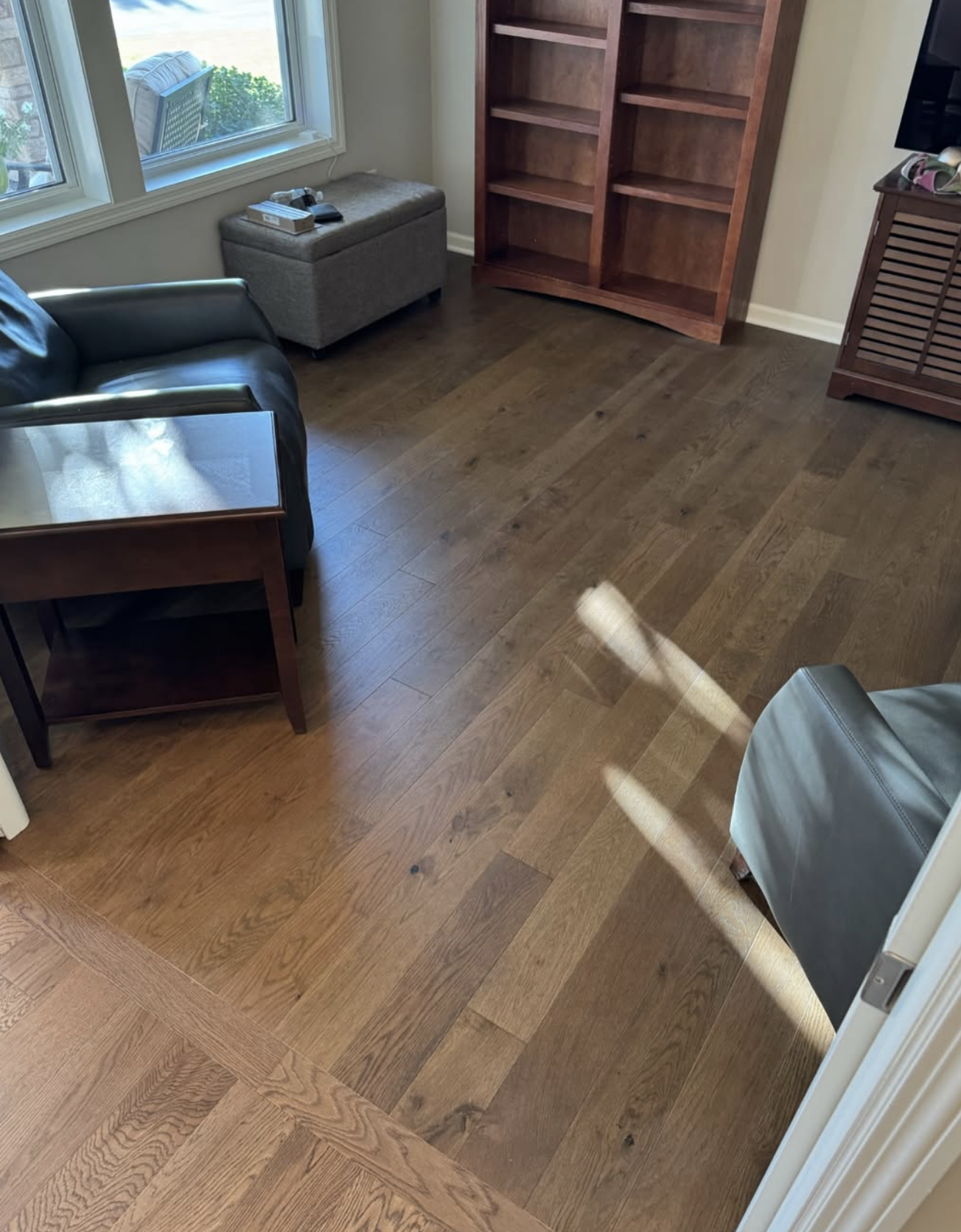 Wide-plank engineered hardwood floor installed in a Minneapolis living room